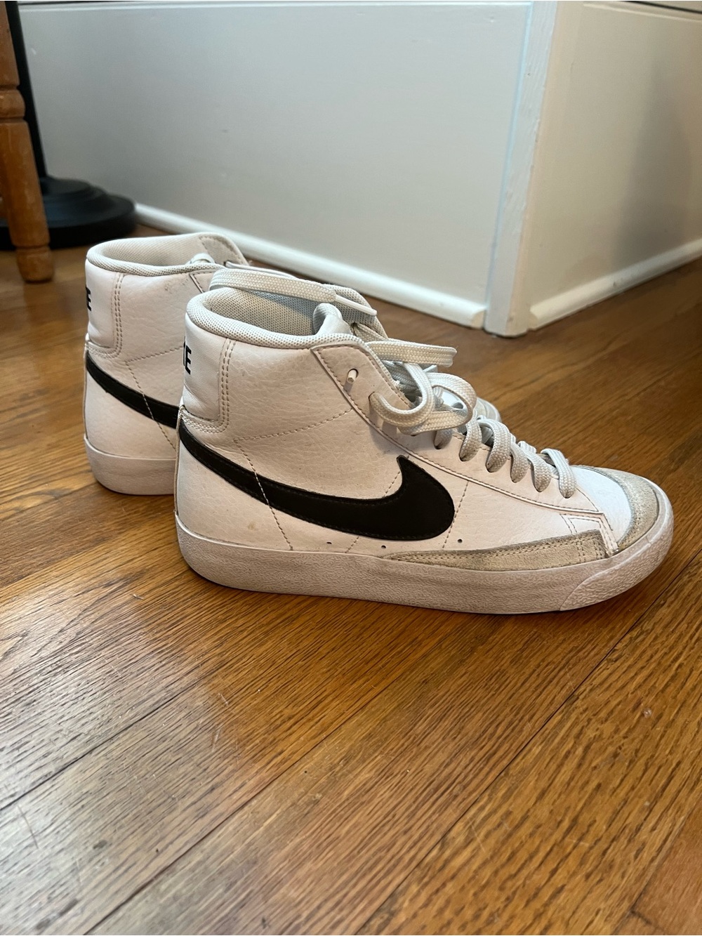 Nike Women’s White High-Top Sneakers with Black Swoosh